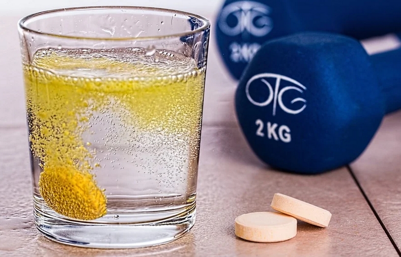 supplement and dumbbells